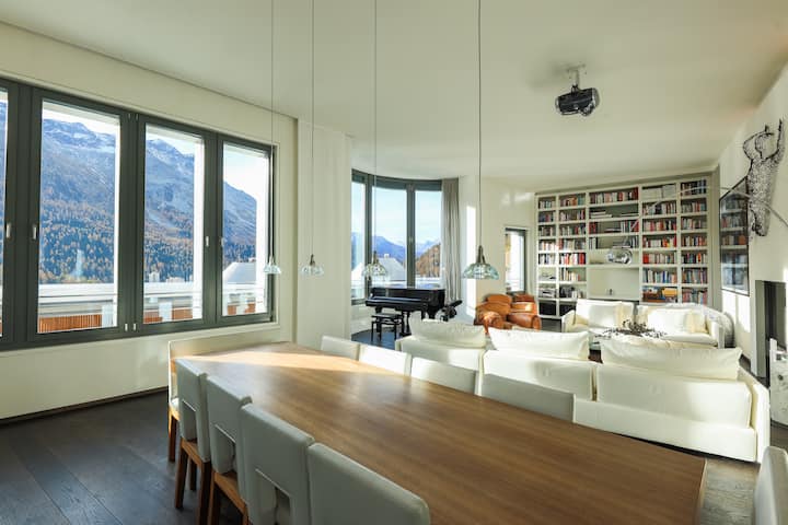 Angelus — dining and living space with panoramic Alpine views