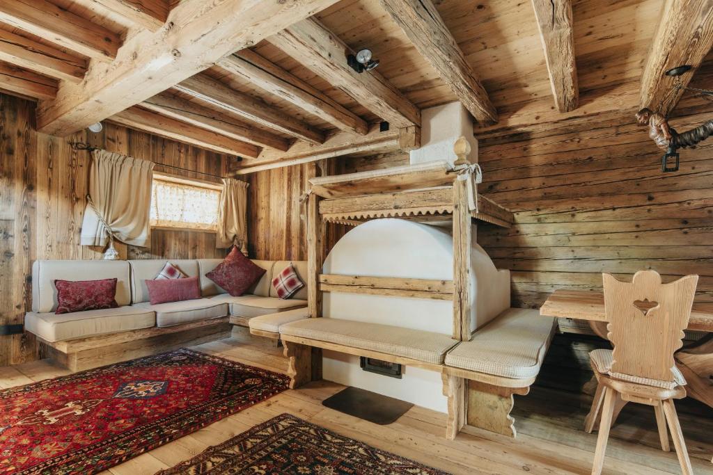 Casa Aurea, Cortina d'Ampezzo — living and dining room in reclaimed Alpine timber