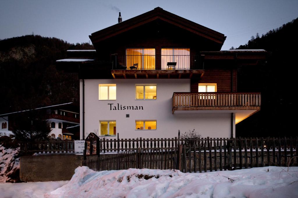 Chalet Talisman, Zermatt — chalet exterior illuminated at night